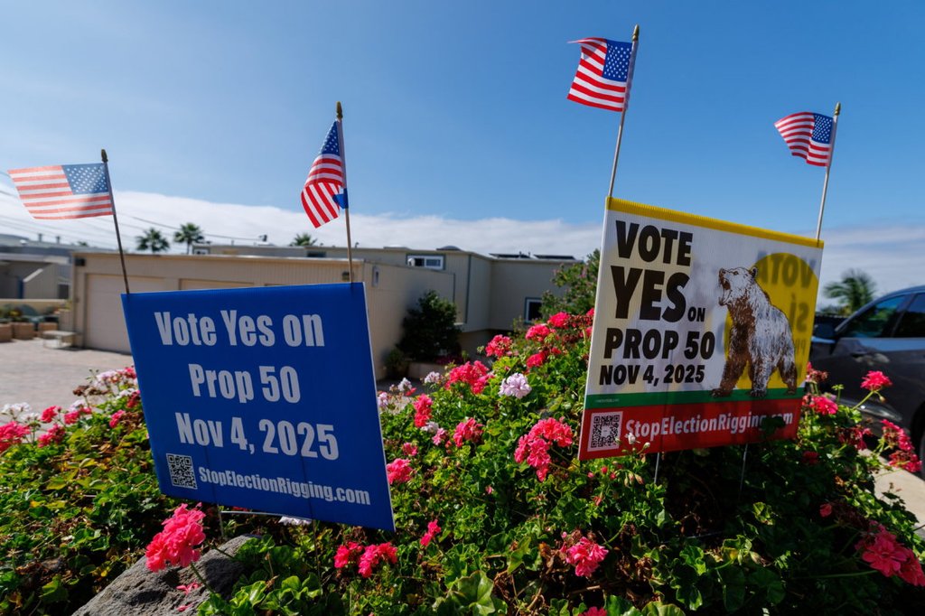 Signs supporting Proposition 50, aimed at countering Republican-led redistricting in Texas by redrawing California's congressional map to favor Democrats, in a residential neighborhood in Encinitas, California, U.S., September 29, 2025. REUTERS/Mike Blake